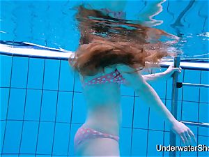 stunning girl displays wondrous figure underwater